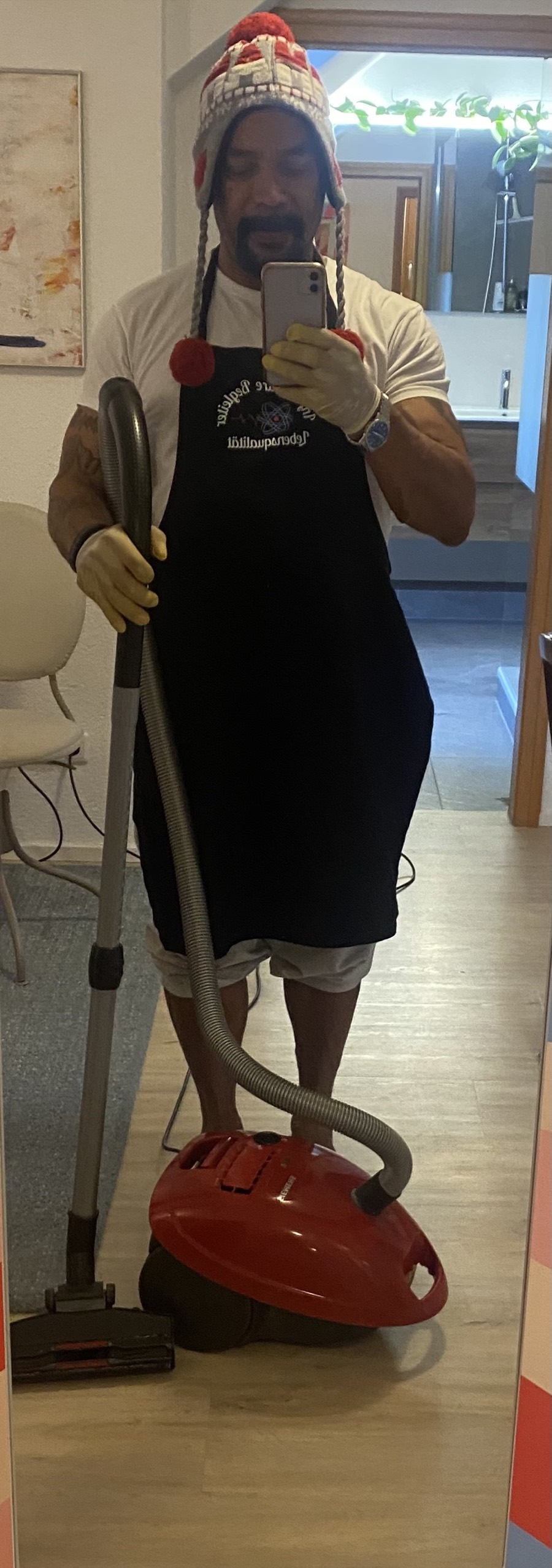Infinity Care Begleiter team member holding cleaning equipment